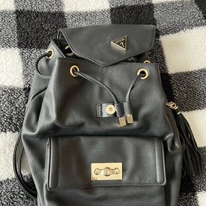 Black GUESS backpack style purse. Lightly used